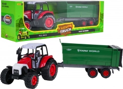 Kovinski traktor z odklopno prikolico na vztrajnik