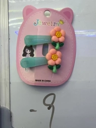 Sponka za lase z oranžnim cvetom