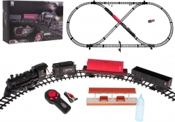 Vlak s dimno lokomotivo, lučjo in glasbo