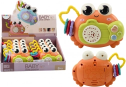 Interaktivni rak s ropotuljico in projektorjem, oranžen