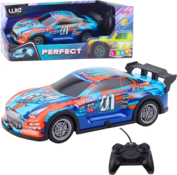 RC dirkalni avto s svetlečo karoserijo, oranžno‑turkizen