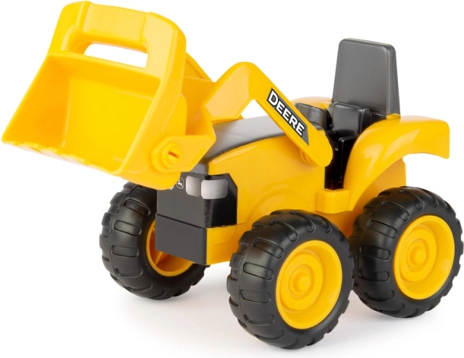 Traktor/nakladalnik za zajemanje in premikanje materiala