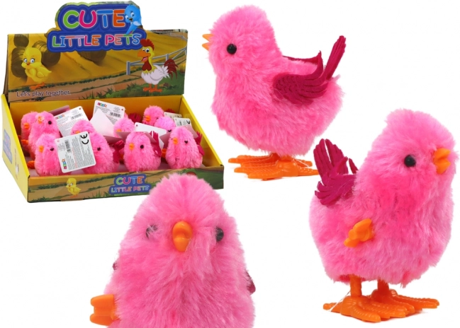 Skakajoča igračka roza piščanec