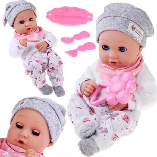 Punčka dojenček 32 cm s premičnimi vekami in setom za hranjenje