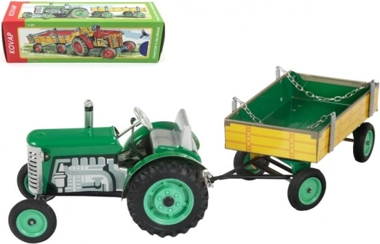 Zeleni traktor Zetor s prikolico in vzmetnim mehanizmom Kovap