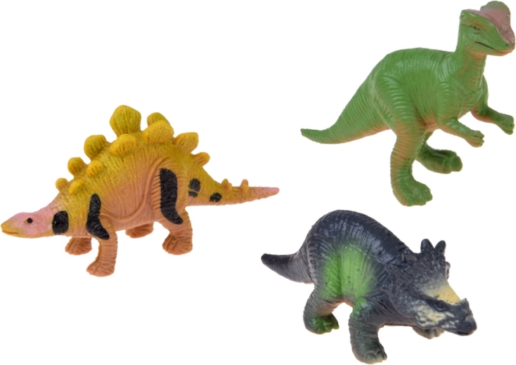 3 dinozavrske figurice in svetleče nalepke