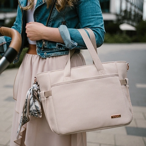 On the stroller, over the shoulder, or in your hand