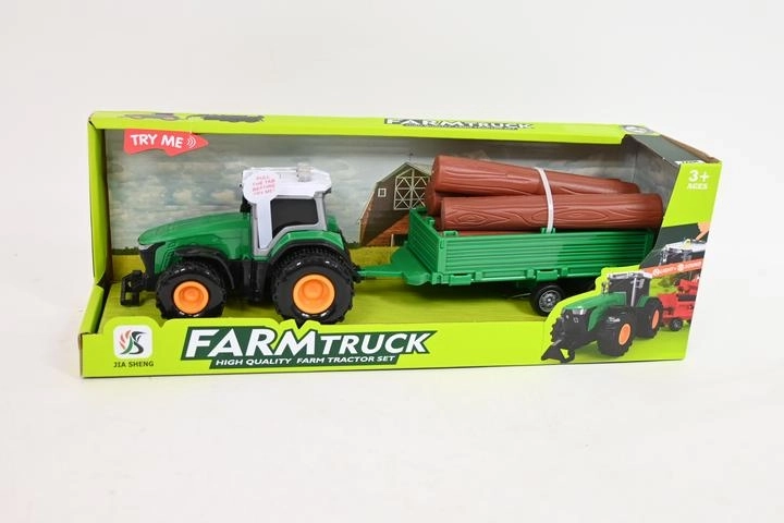 Traktor s prikolico in hlodi
