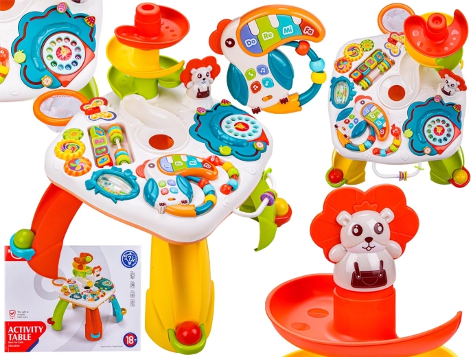 Educational interactive play table for children with a slide, rattle and melodies