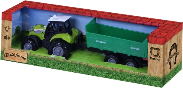 Traktor z zvoki in lučjo z zeleno prikolico