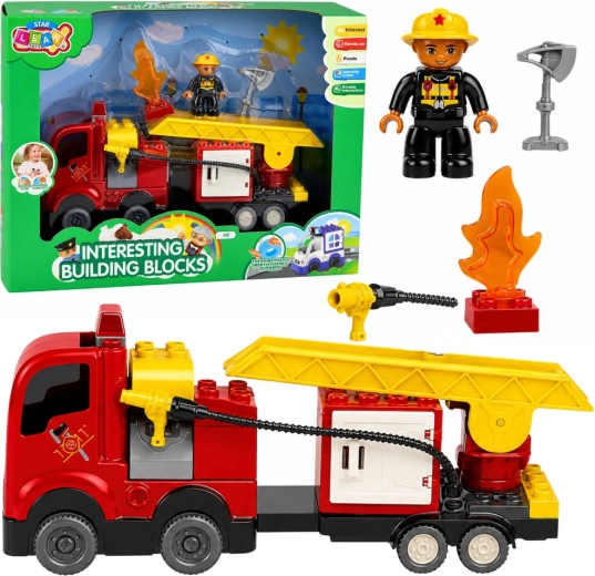 Gradbeni komplet gasilski avto s trenjskim pogonom, lestvijo in gasilsko figurico