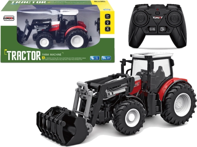 Rdeč daljinsko voden traktor 2,4 GHz z gibljivo žlico 1:24