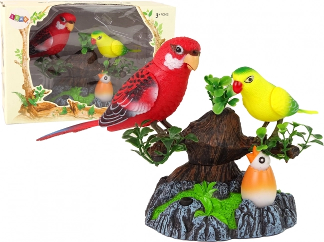 Pojejoči gibljivi papagaji na barvitem drevesu