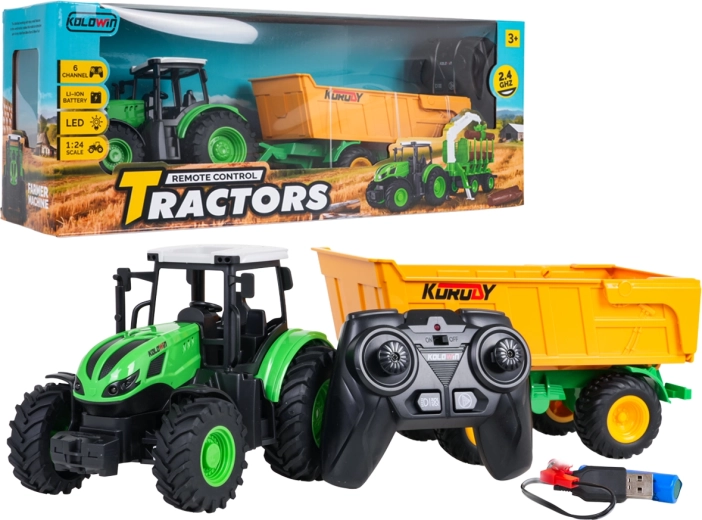 Daljinsko voden traktor z rumeno prekucno prikolico v merilu 1 : 24
