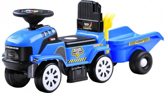 Poganjalec traktor s prikolico in melodijami za otroke – Traktor