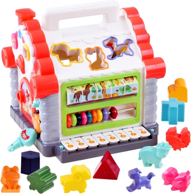 Interaktivna hišica – glasbena vstavljanka oblik in živalic za otroke 18+ mesecev