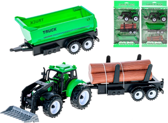 Zeleni traktor s sprednjim nakladalnikom in 2 zamenljivima prikolicama na vztrajnik