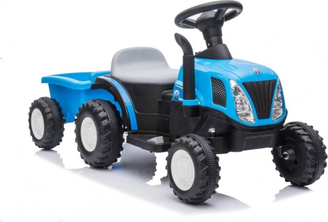 Otroški modri traktor na baterije s prikolico