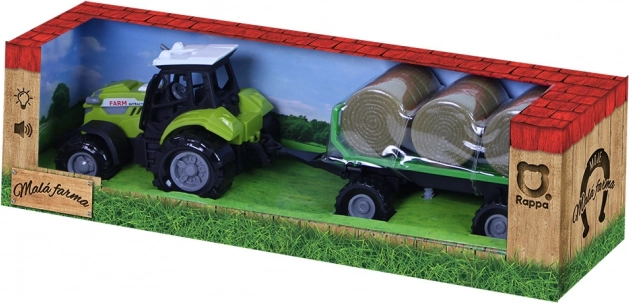 Traktor z zvokom in svetlobo s prikolico in balami sena