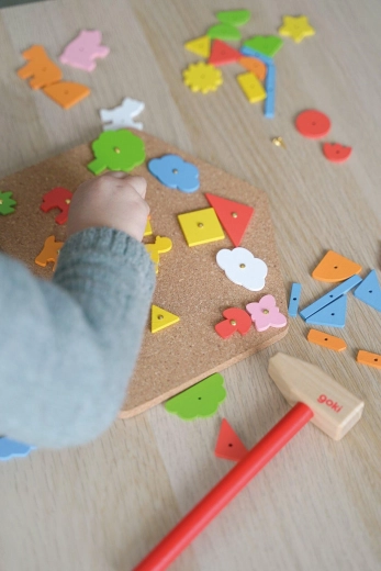 Hammer-and-nail game with a hammer and nails – House