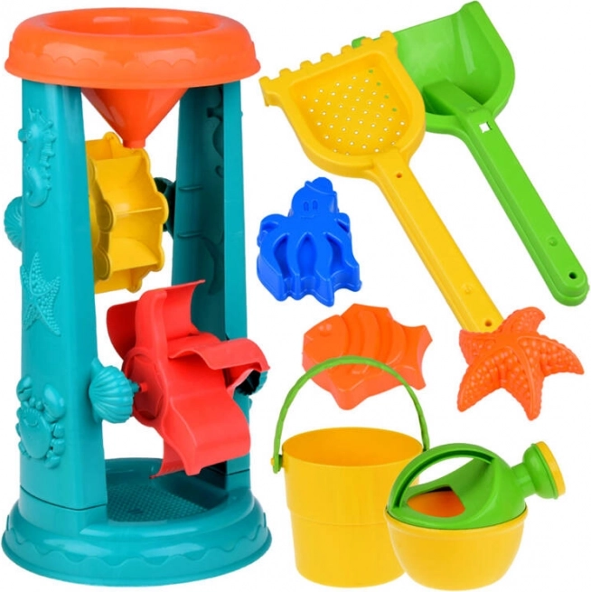 Velik komplet peskovnih igrač s vedrom, grabljicami in vodnim kolesom