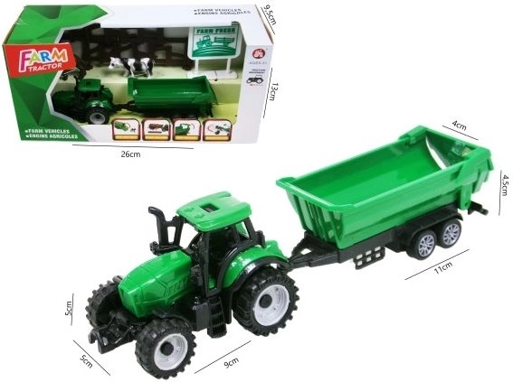 Zeleni traktor s prikolico in dodatki