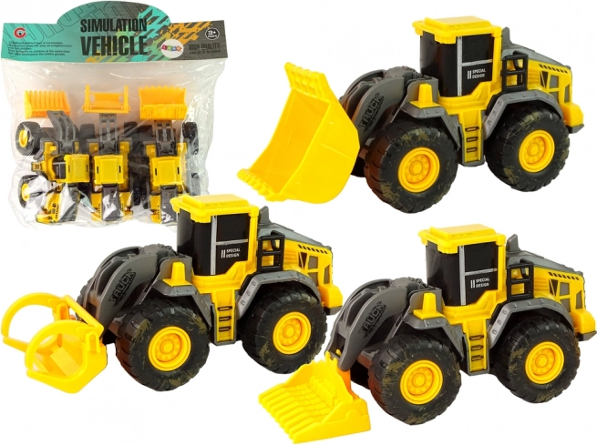 Komplet treh rumenih gradbenih vozil