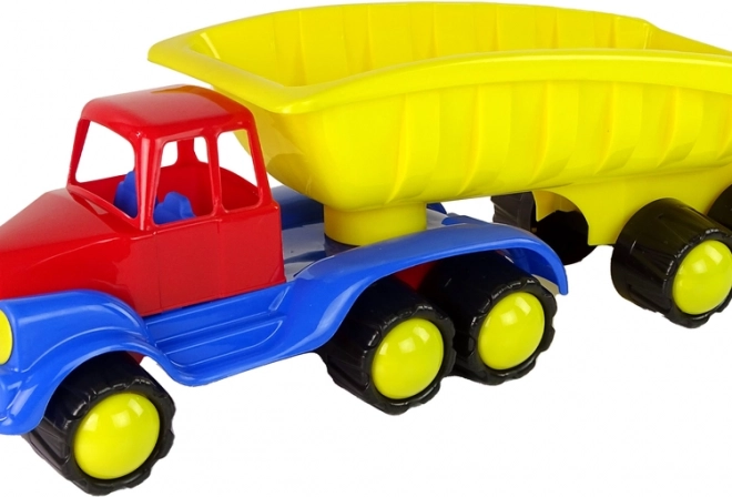 Velik tovornjak z rumeno prikolico dolžine 45 cm