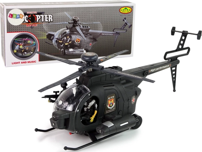 Vojni helikopter s krili in svetlobnimi učinki na baterije