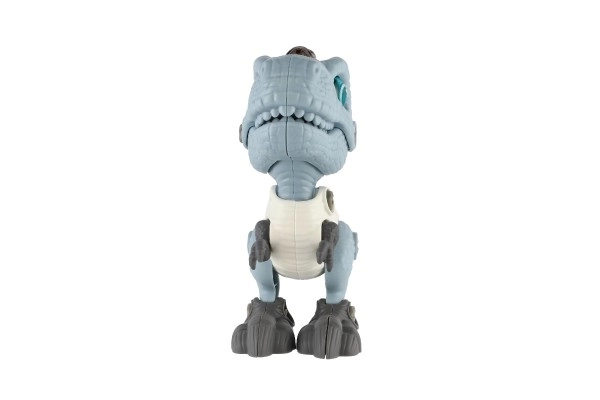 Dinozaver vijačen plastičen 12cm z izvijačem na baterije s svetlobo in zvokom v škatlici 15x16x7cm