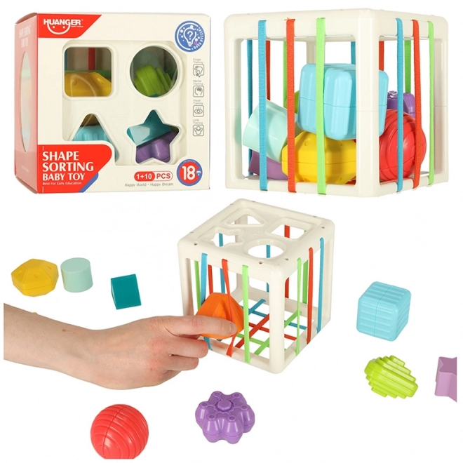Fleksibilna senzorična kocka s kvadratičnimi puzzle bloki in sortatorjem oblik