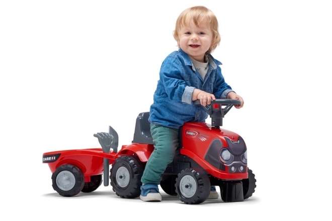 Vozeči traktor Baby Case IH rdeč s prikolico