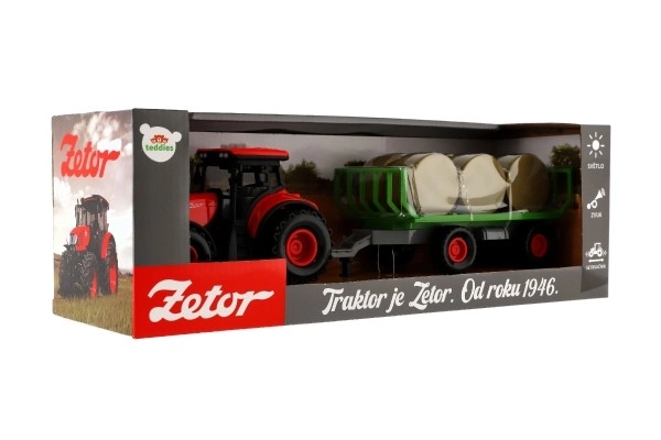 Traktor Zetor s prikolico in balami plast 36cm na vztrajnost na bat. z lučjo in zvokom v škat. 39x13