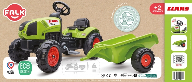 Šlapalni traktor Claas Arion 410 z zeleno prikolico