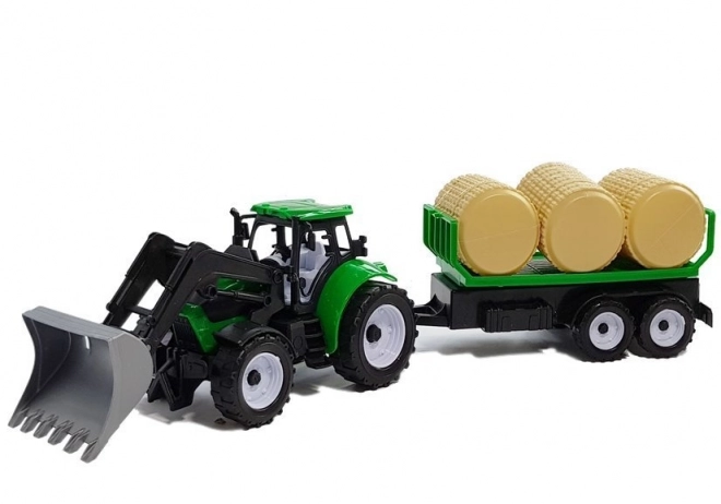 Traktor s prikolico za bale sena Cisterne