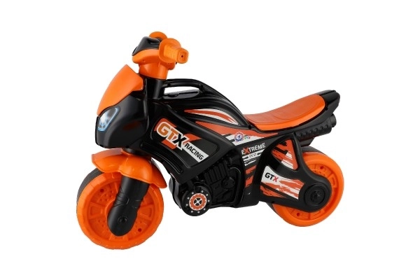 Poganjalec motor oranžno-črno plast v vrečki 35x53x74cm 24m+