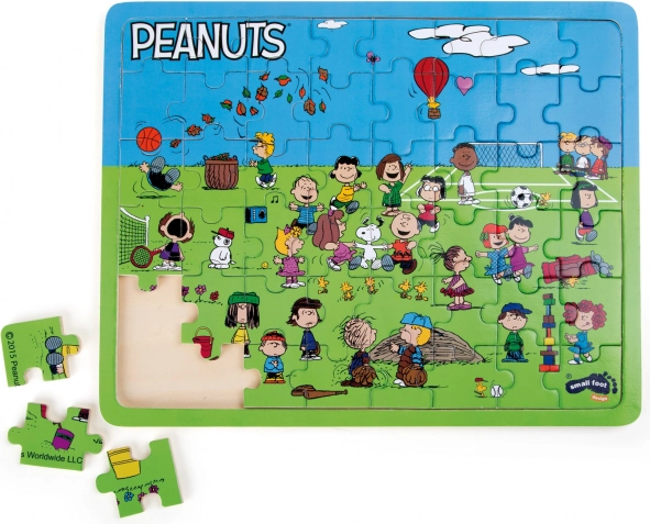 Male nožičke Lesena sestavljanka Snoopy na igrišču