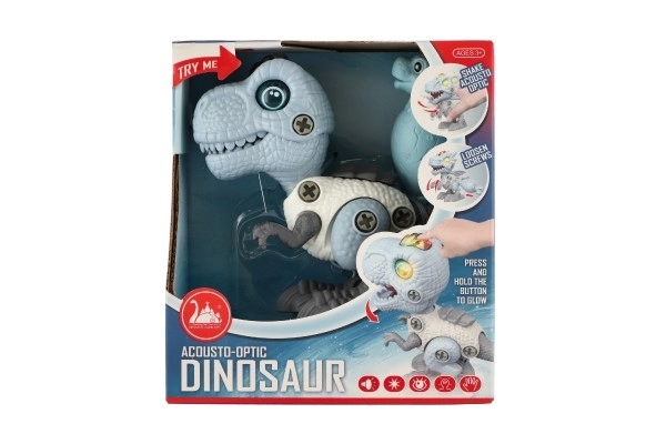 Dinozaver vijačen plastičen 12cm z izvijačem na baterije s svetlobo in zvokom v škatlici 15x16x7cm