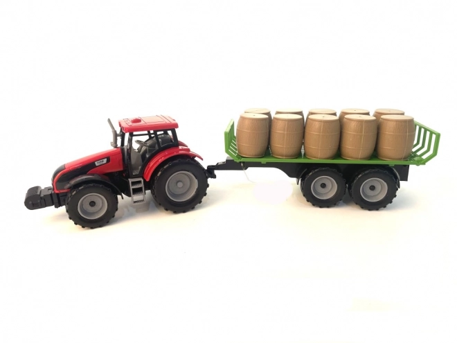 Traktor z vztrajnikom in prikolico polno sena