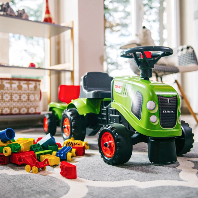 Poganjalec traktor Claas zelen z volanom in prikolico