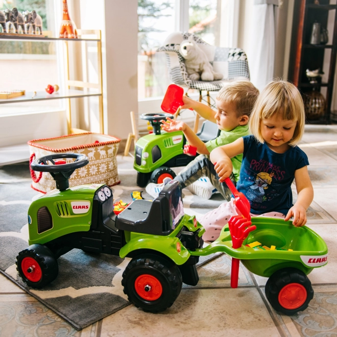 Poganjalec traktor Claas zelen z volanom in prikolico