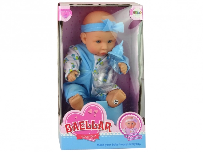 Punčka dojenček na kahlici z modro pentljico
