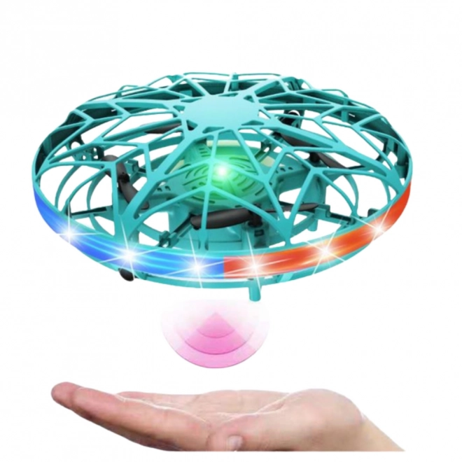 UFO dron lahko upravljan z roko z LED lučkami turkizne barve