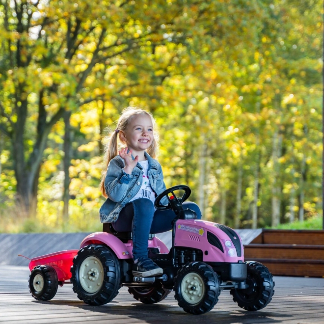 Traktor z nožnim pogonom County Star z roza prikolico