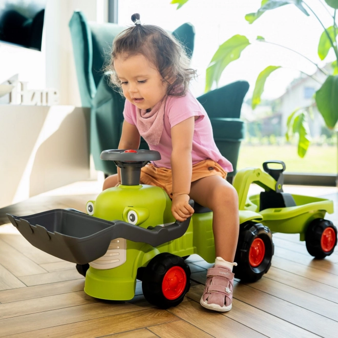 Vozni traktor Claas s prikolico, nakladalnikom in žlico