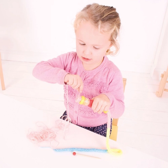 Bigjigs Toys pletilna punčka
