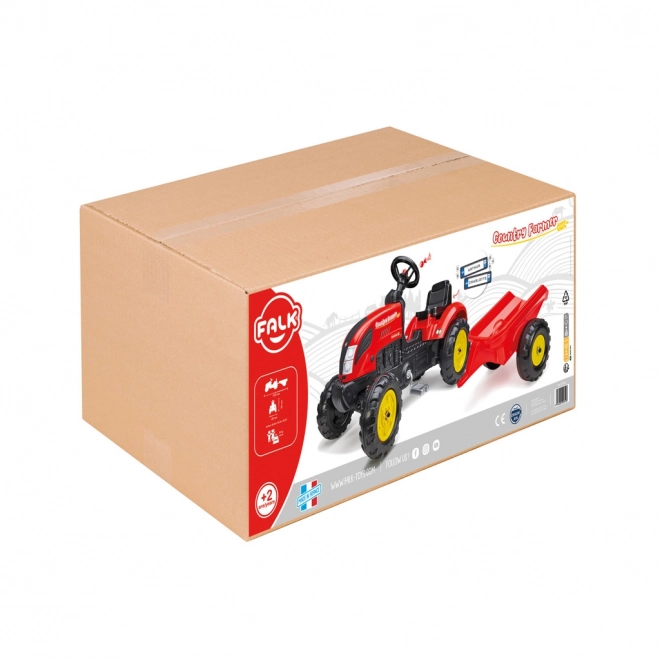 Pedalni traktor z rdečo prikolico