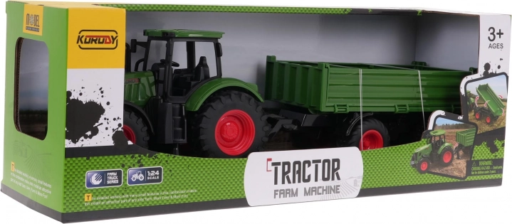 Zeleni traktor s prikolico