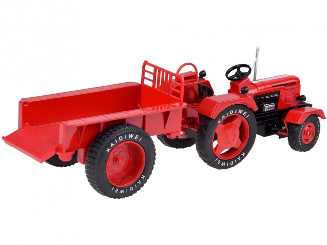 Rdeči kovinski traktor z gumijastimi kolesi 1:18