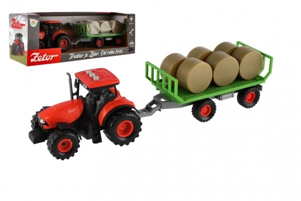 Traktor Zetor s prikolico in balami plast 36cm na vztrajnost na bat. z lučjo in zvokom v škat. 39x13